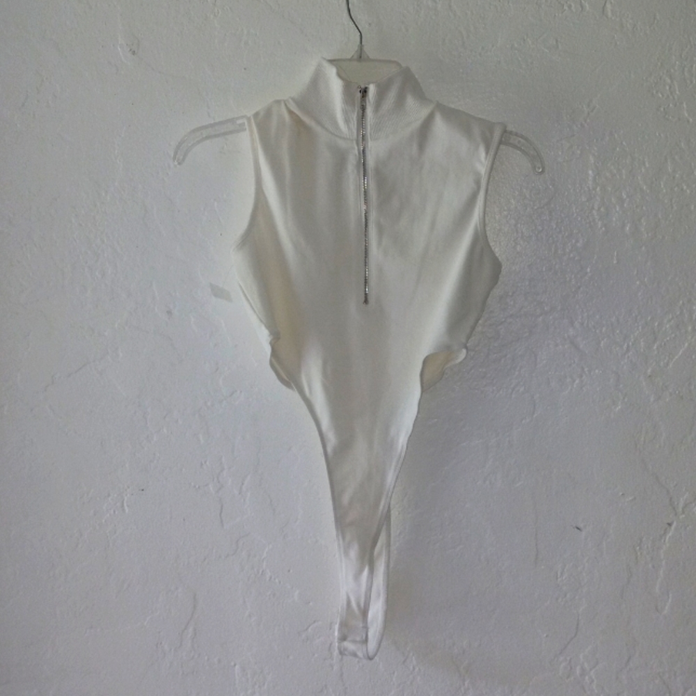 Med Blanc Clothing leave this turtleneck bodysuit with zipper up front, high cut
